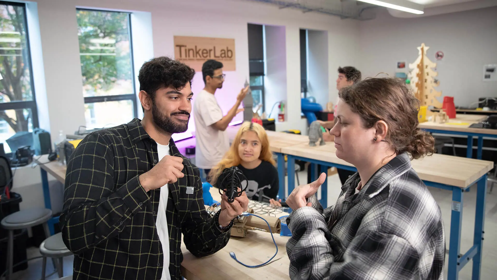 Students talking to each other in the TinkerLab