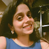 Woman in blue tank top smiles