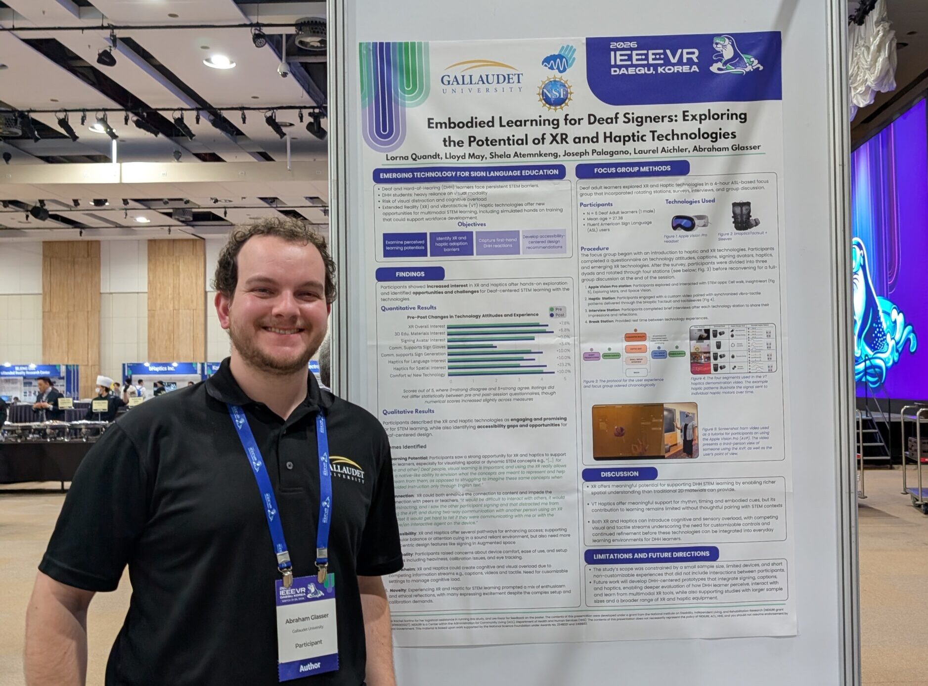 Man stands next to a scientific poster at a conference