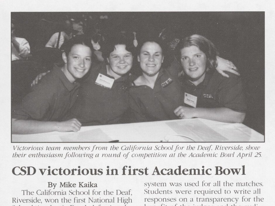 A cropped image from a black and white newsletter. On top, a photo shows four high school students interlocked and smiling for the camera. Text below: "Victorious team members from the California School for the Deaf, Riverside, show their enthusiasm following a round of competition at the Academic Bowl, April 25."